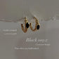 Gold vermeil black onyx croissant huggies in sterling silver 925