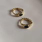 Charming gold vermeil and silver huggies with black onyx croissant design