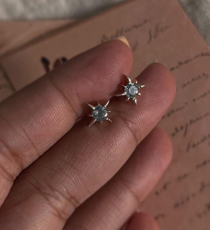 Elegant Blue Topaz Silver Studs with North Star Motif