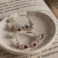 Chic garnet half hoop earrings in a sleek silver design