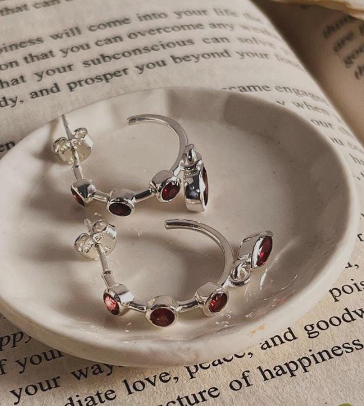 Chic garnet half hoop earrings in a sleek silver design