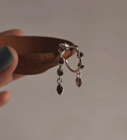 Garnet-studded half hoop earrings for a modern look