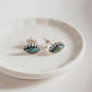 Elegant evil eye silver studs featuring copper and turquoise accents