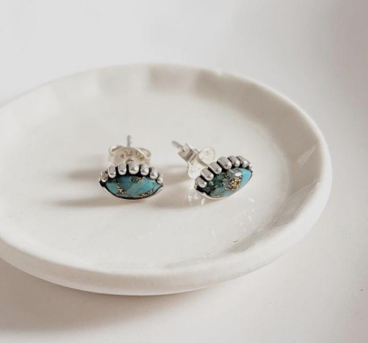 Elegant evil eye silver studs featuring copper and turquoise accents