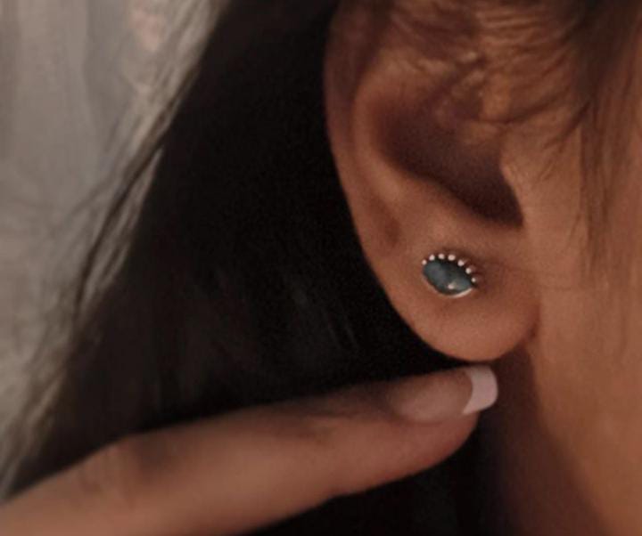 Boho-inspired evil eye silver studs with copper and turquoise gemstone