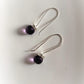 Delicate 925 Sterling Silver hook earrings with round cut amethyst gemstones.