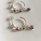 Sophisticated half hoop earrings with vibrant garnet gemstones