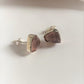 Sterling silver studs featuring raw uncut rose quartz stones