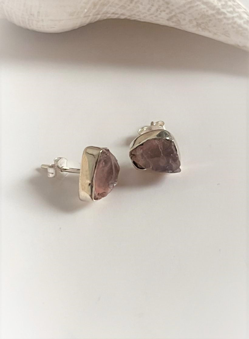 Sterling silver studs featuring raw uncut rose quartz stones