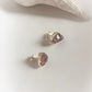 Delicate raw rose quartz silver studs for a minimalist style