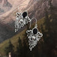 Elegant vintage 925 Sterling silver earrings with garnet stones