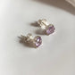 Elegant 4mm round cut amethyst stud earrings.