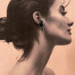 Elegant black onyx pear-shaped silver studs with a bohemian style.
