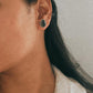 Boho-inspired black onyx pear silver studs with intricate design.