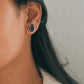 Sleek boho-style black onyx pear silver studs for a bold statement.