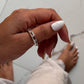 Elegant five stone silver ring featuring clear quartz gemstones