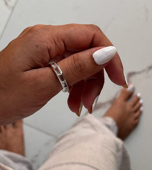 Elegant five stone silver ring featuring clear quartz gemstones