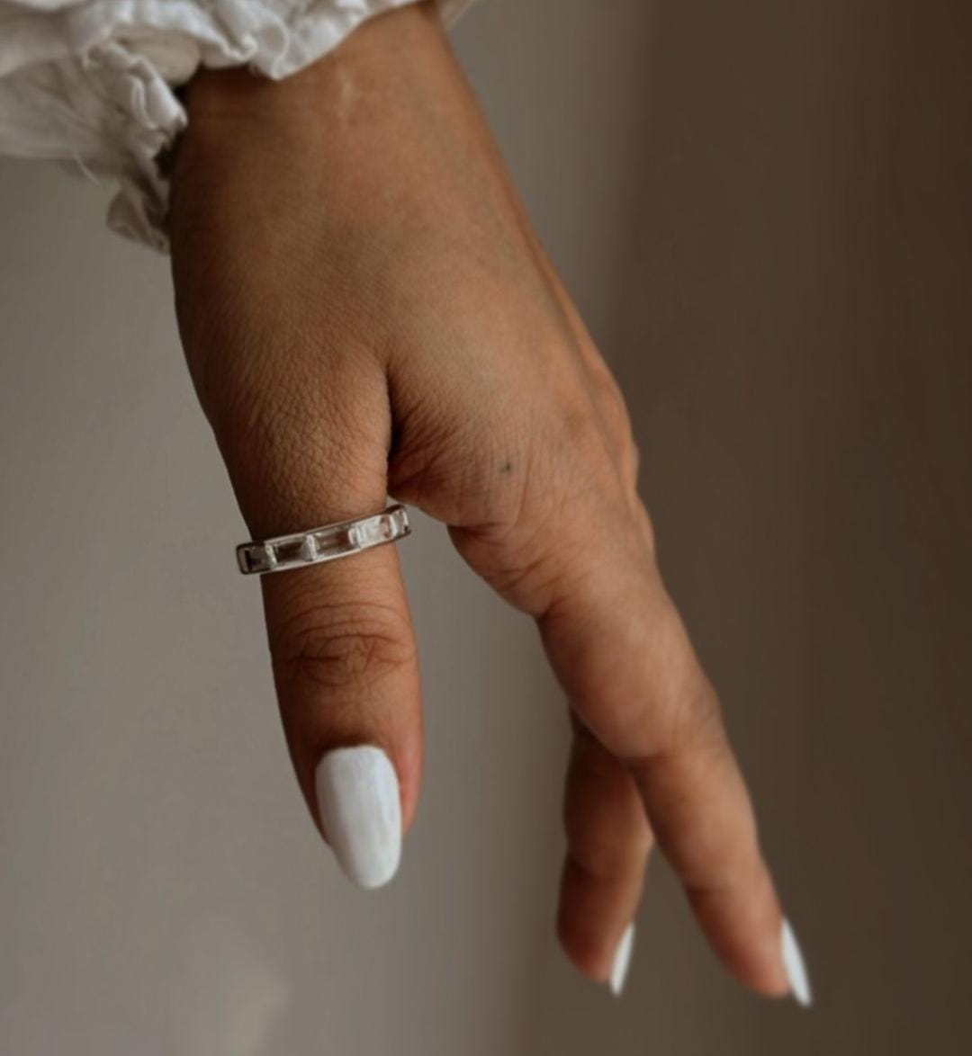 Clear quartz five stone silver ring with clean, polished finish
