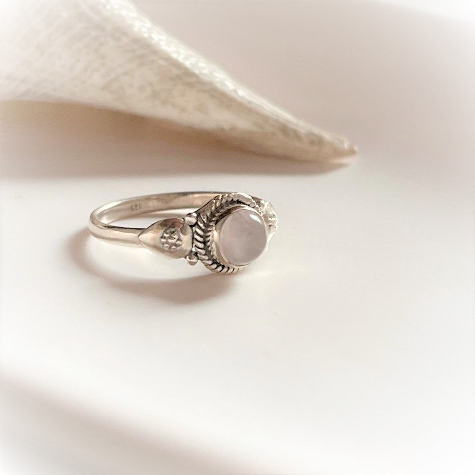 Delicate round rose quartz ring with intricate boho silver design