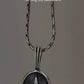 Charming round hemp design pendant in sterling silver