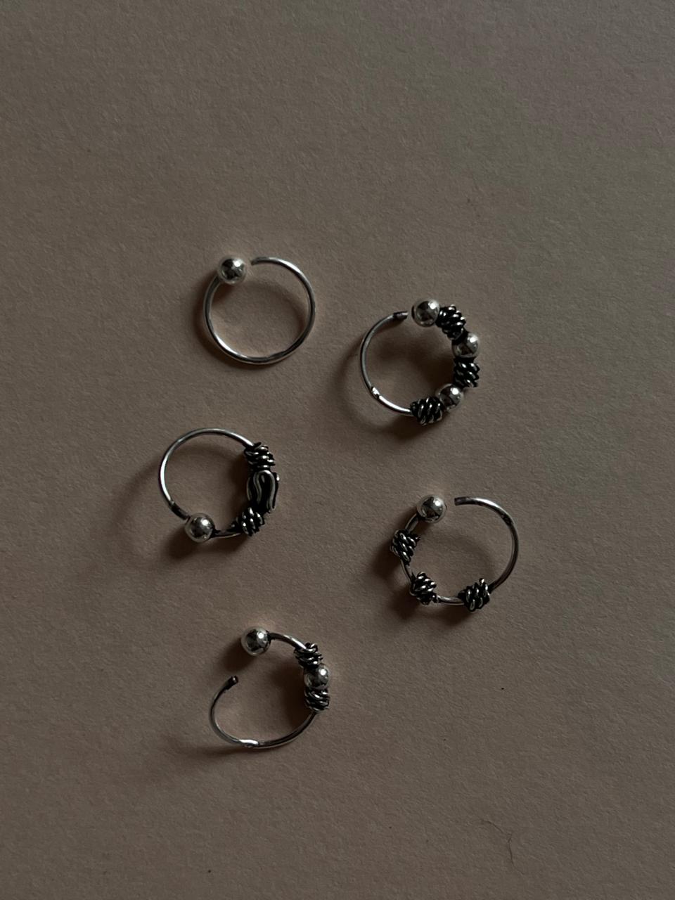 Antique-style boho nose rings in a set of 5 with intricate details.