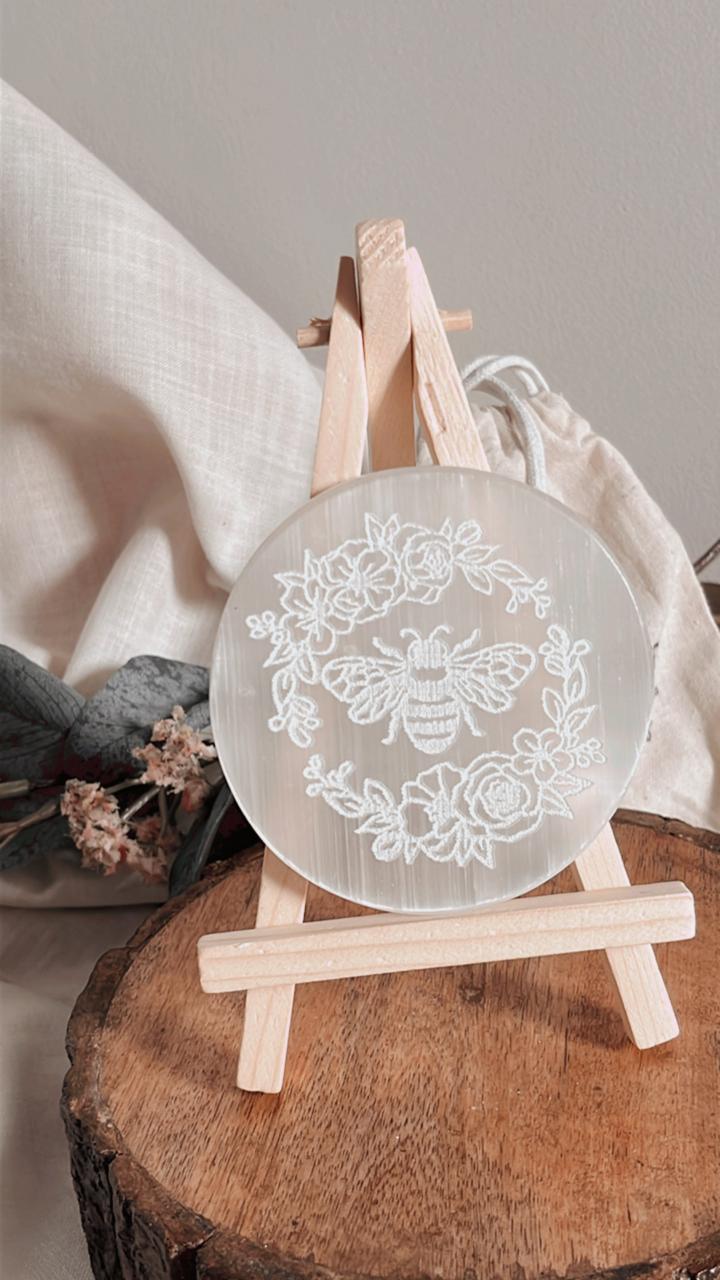 Healing selenite charging plate featuring a detailed bee design