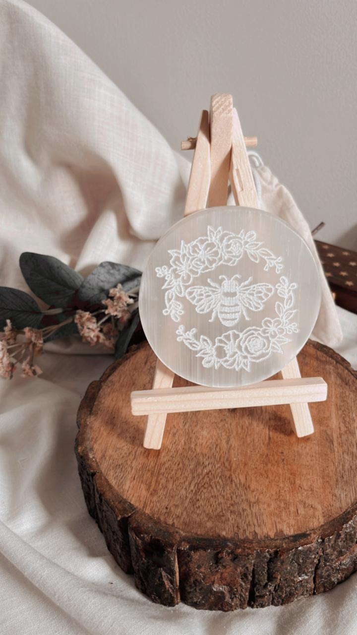 Selenite plate with bee engraving for energy recharging