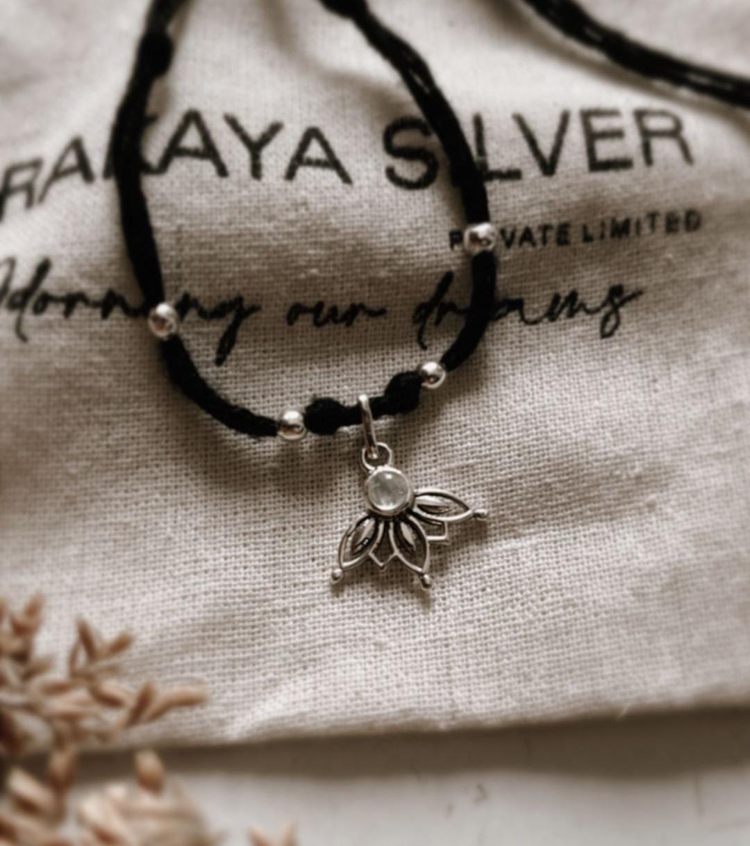 Delicate Moonstone Lotus Charm Nazariya