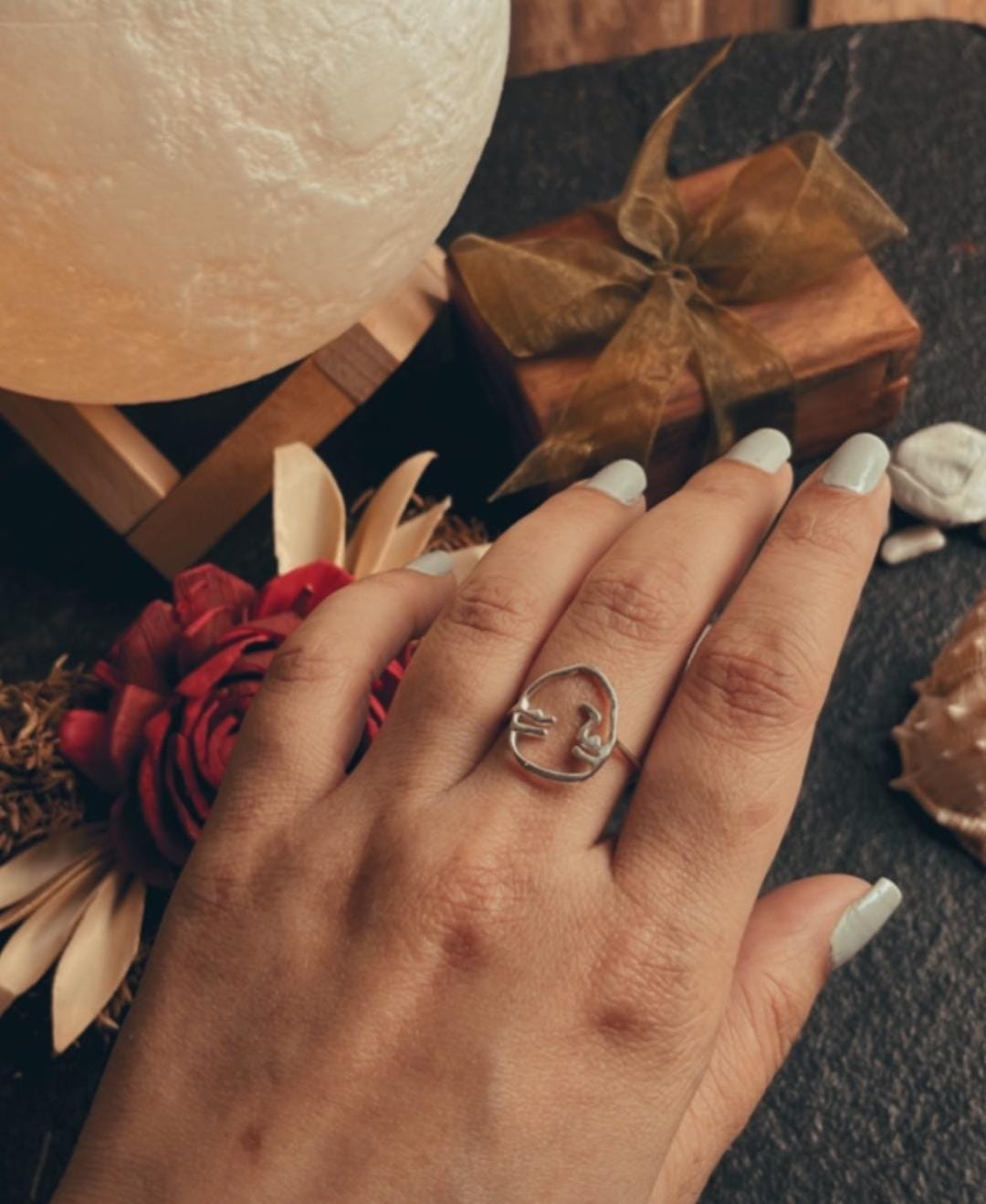 Elegant visage design silver ring