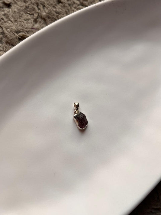 Raw uncut garnet gemstone pendant in sterling silver