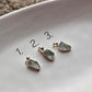 Raw uncut aquamarine gemstone pendant set in sterling silver.