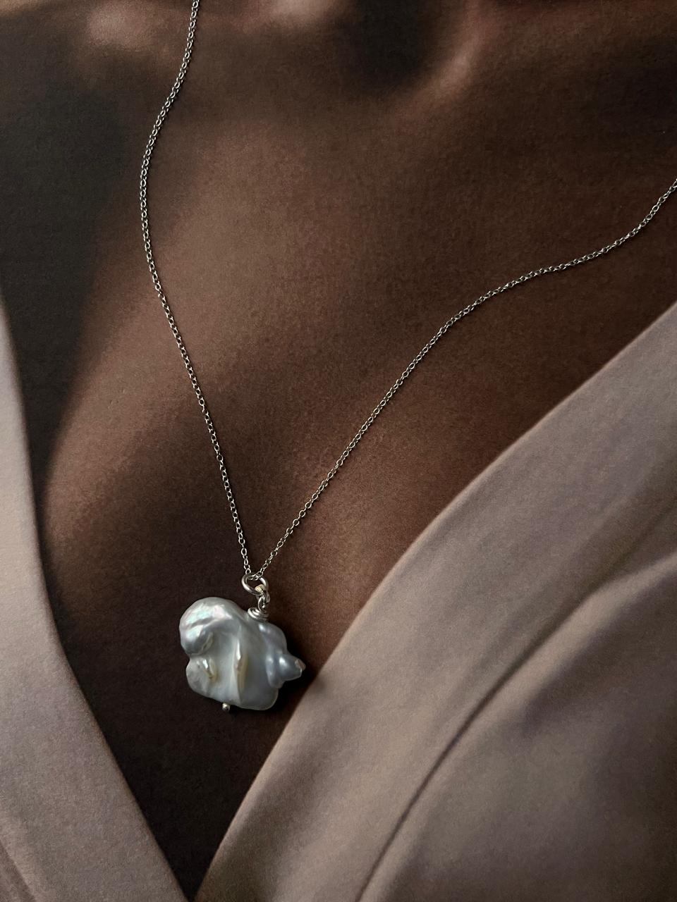 Beautiful silver necklace with four Baroque pearls for a bold and stylish statement.