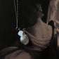 Classic silver necklace featuring three Baroque pearls with natural elegance.