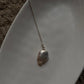 Classic silver necklace with two stunning Baroque pearls as the centerpiece.