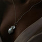 Elegant necklace with three Baroque pearls, each with a unique shape and luster.