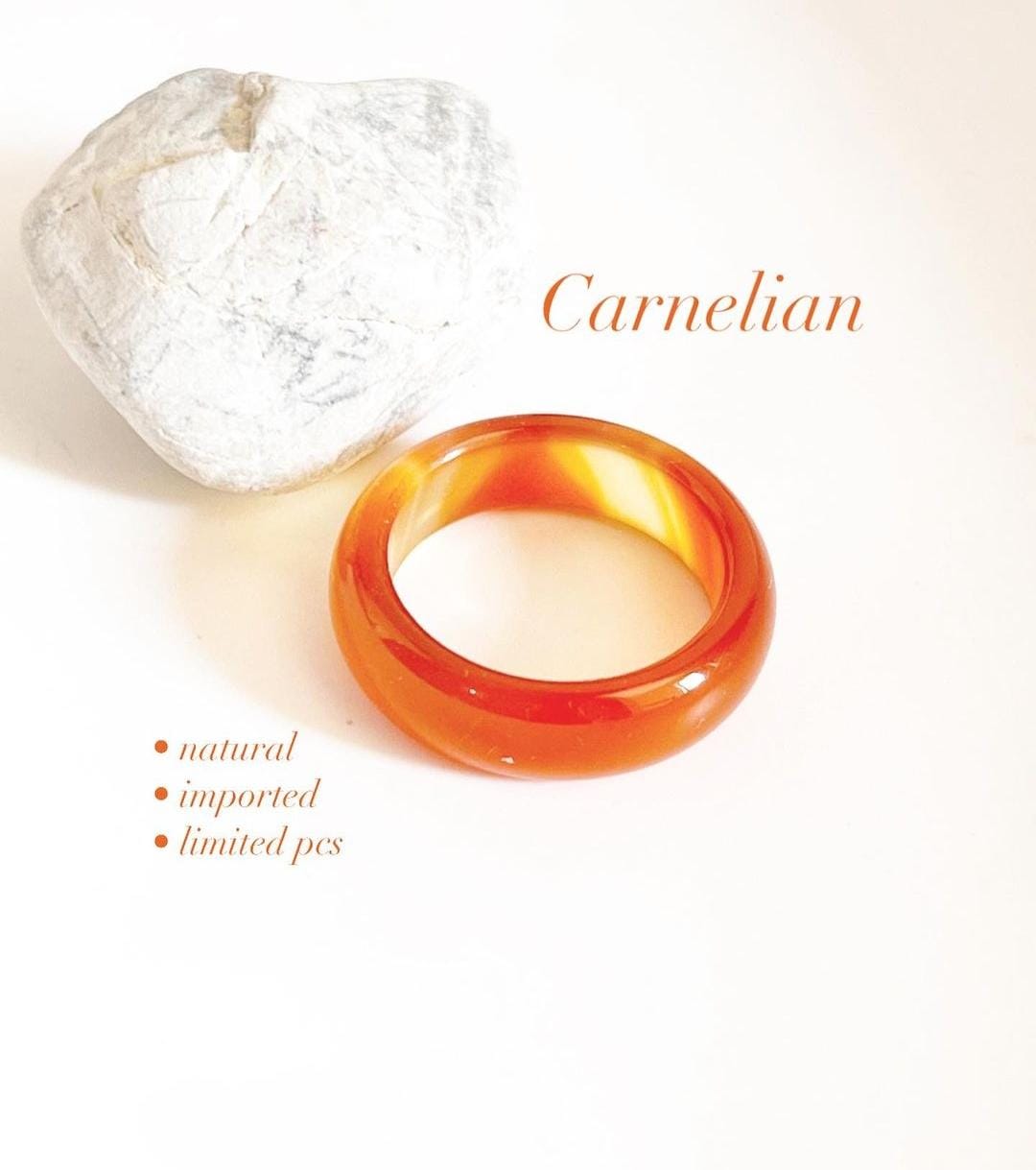 Carnelian crystal band ring with vibrant orange hue