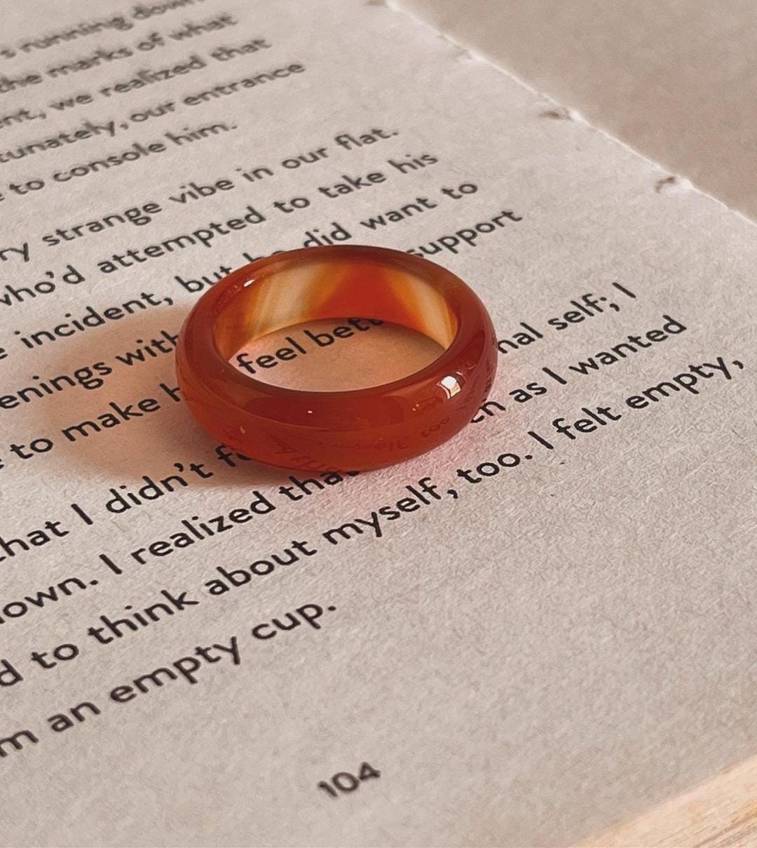 Carnelian crystal band ring with smooth, rounded edges