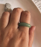 Sleek green aventurine stone set in a silver band ring