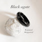 Sleek black agate crystal band ring with polished finish.