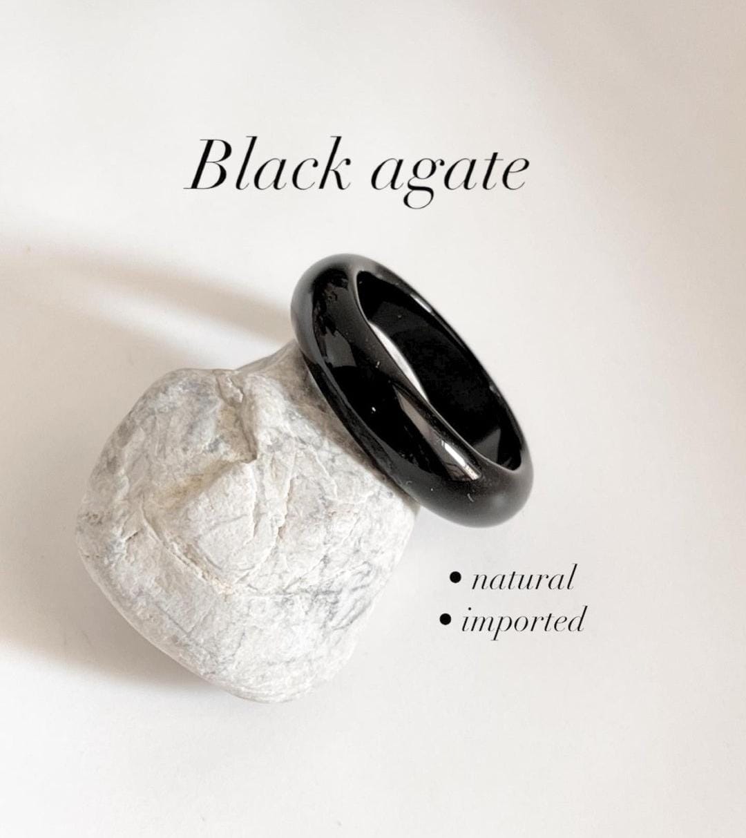 Sleek black agate crystal band ring with polished finish.