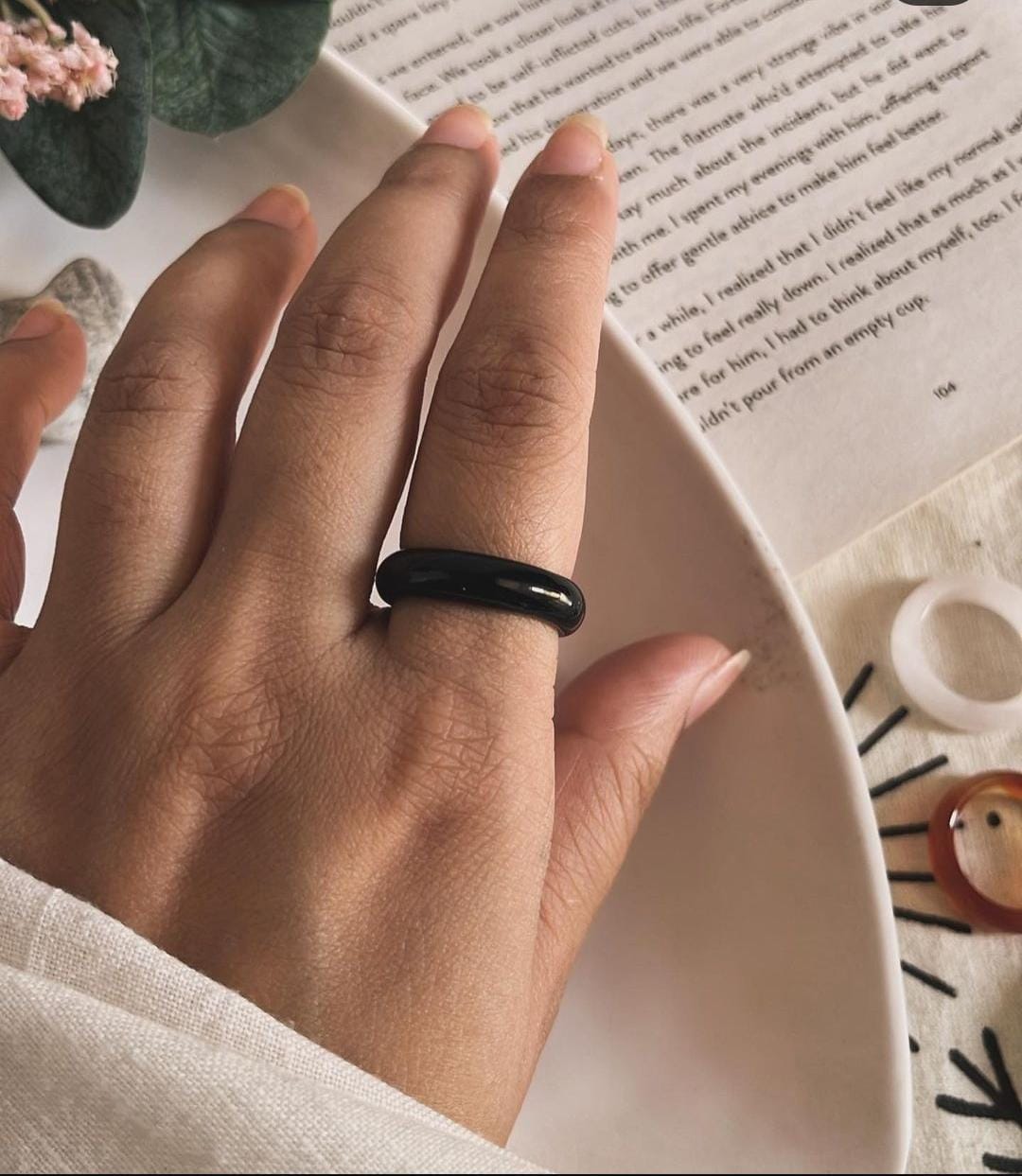 Sophisticated black agate crystal ring with a sleek band design.