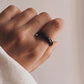 Handcrafted black agate crystal band ring with a smooth, modern look.