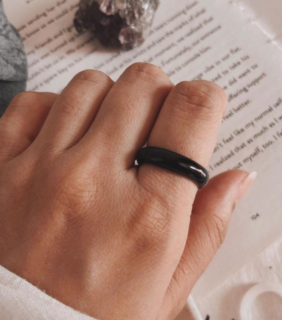 Elegant black agate crystal ring featuring a bold band design.