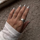 Stylish silver ring with three interlinked chunky bands