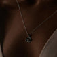 Sterling silver necklace featuring a delicate rose pendant