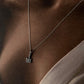 Sleek silver necklace with guitar 2 pendant design