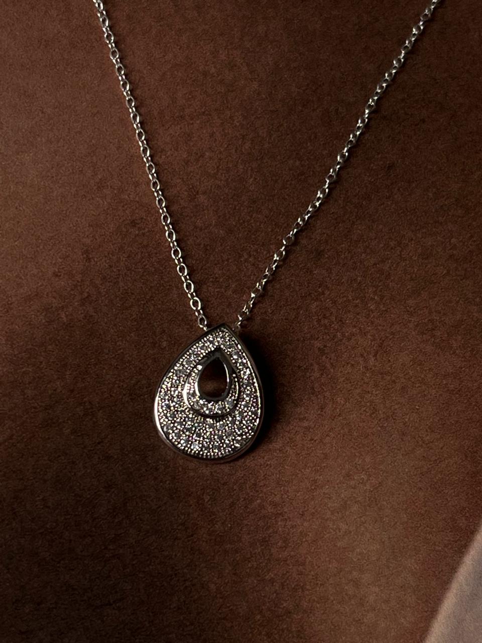 Close-up of Drop 1 silver necklace with minimalistic pendant