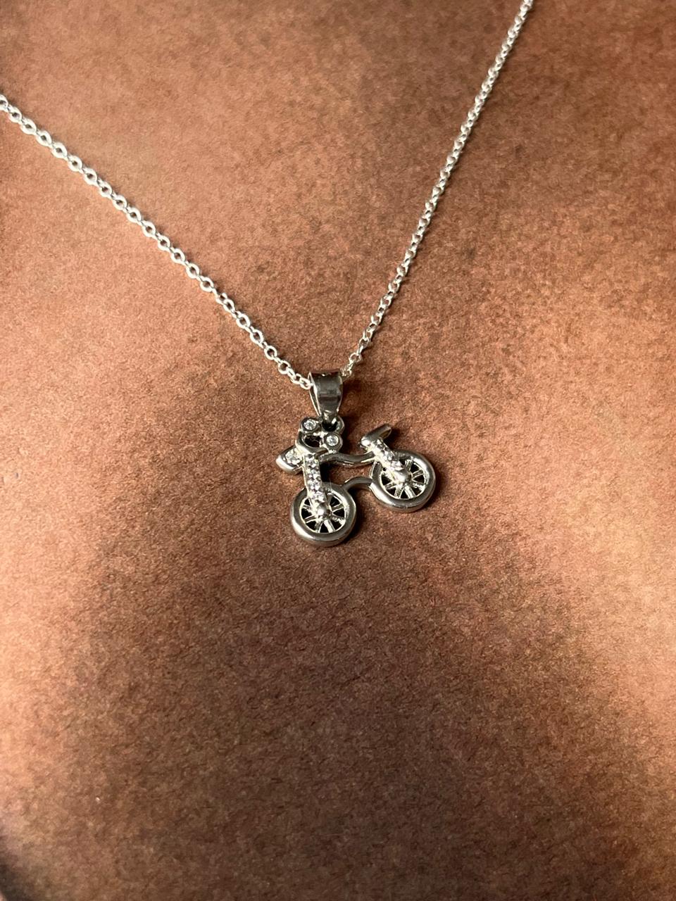 Close-up of cycle 2 pendant in fine sterling silver
