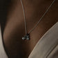 Close-up of cycle 1 pendant in fine sterling silver