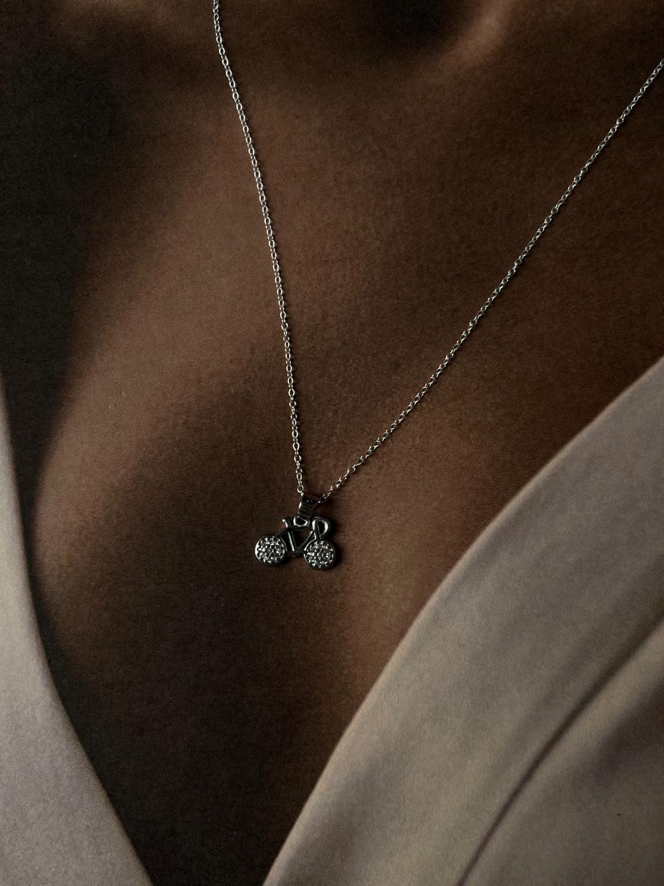 Close-up of cycle 1 pendant in fine sterling silver